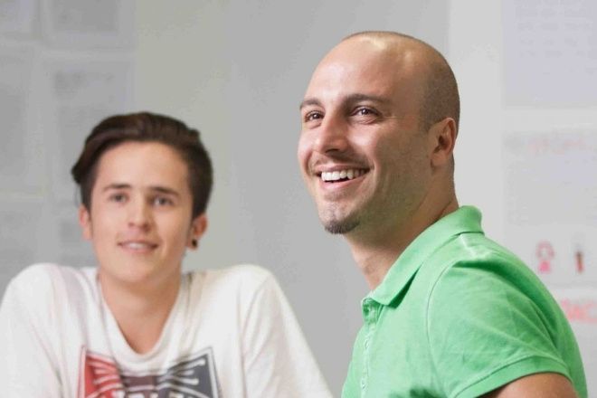Two males students in a class.