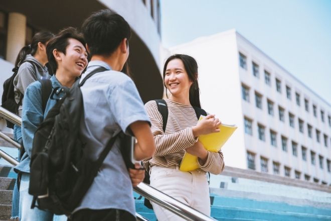 Students standing on stairs.
